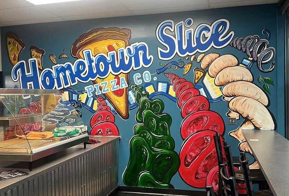 Colorful Hometown Slice Pizza Co. mural with pizza, pepperoni, soda, and a cozy dine-in counter.